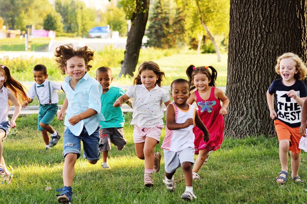 Happy kids running in a park
